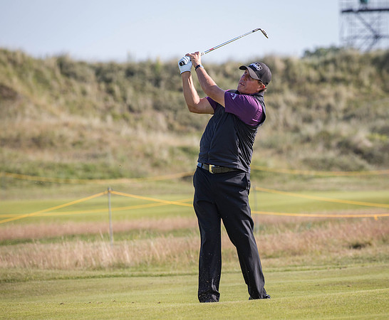 Phil Michelson takes a wedge to the green