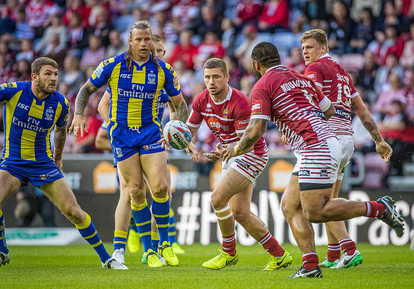 Michael Mc Ilorum gets a move going for Wigan Warriors