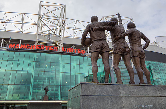 Statues look to each other at Old Trafford