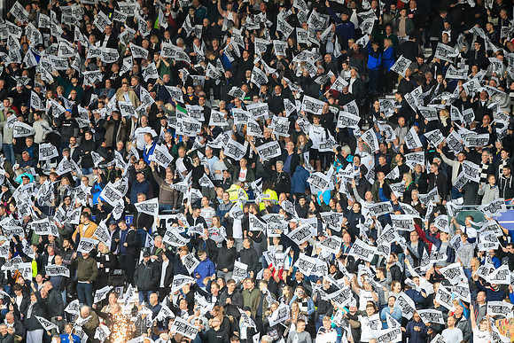 Derby fans wave their flags