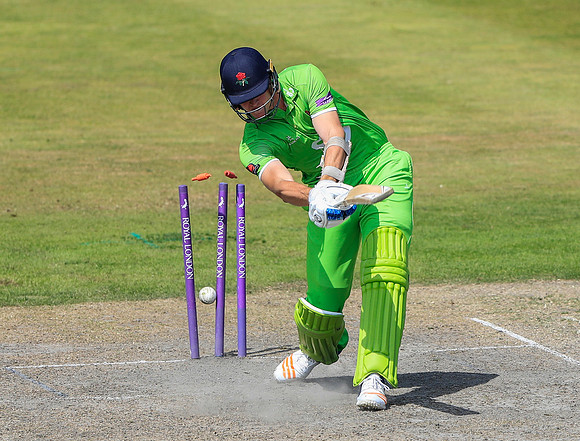 Joe Mennie sees his stumps fall