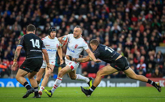 Josh Hodgson of England runs clear