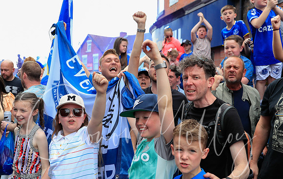 Everton fans await the team bus